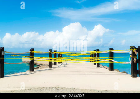 Yellow caution lines at the beginning of a bridges. Stock Photo