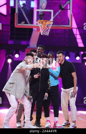 Dwyane Wade, the second from the right, and Bai Jingting, front middle, participate into the Chinese variety show, Dunk of China, in Beijing China, 20 Stock Photo