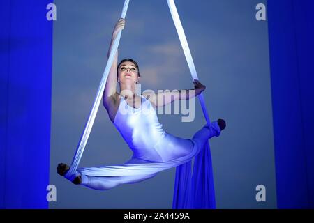 English highly experienced aerialist Amy Panter performs at the Golden Beech Beer City in Qingdao city, east China's Shandong province, 31 July 2019. Stock Photo