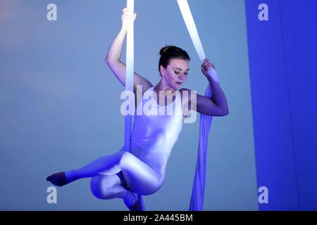 English highly experienced aerialist Amy Panter performs at the Golden Beech Beer City in Qingdao city, east China's Shandong province, 31 July 2019. Stock Photo