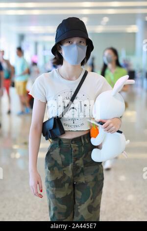 Chinese actress Zhang Xueying, also known as Sophie Zhang, arrives at the Shanghai Hongqiao International Airport before departure in Shanghai, China, Stock Photo