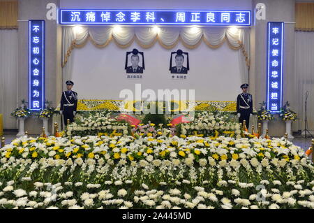 Thousands of people spontaneously gather to attend the funeral of two sacrificed policemen, Li Ke and Zhou Zhengliang, who died during the rescue oper Stock Photo