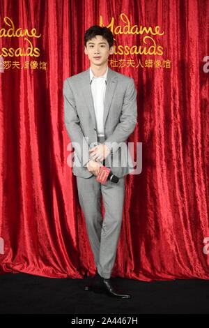 Chinese actor Bai Jingting attends an unveiling ceremony for his own wax figure at the Madame Tussauds museum in Beijing, China, 20 August 2019. Stock Photo