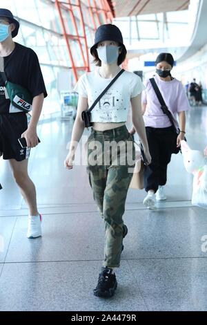 Chinese actress Zhang Xueying, also known as Sophie Zhang, arrives at the Shanghai Hongqiao International Airport before departure in Shanghai, China, Stock Photo