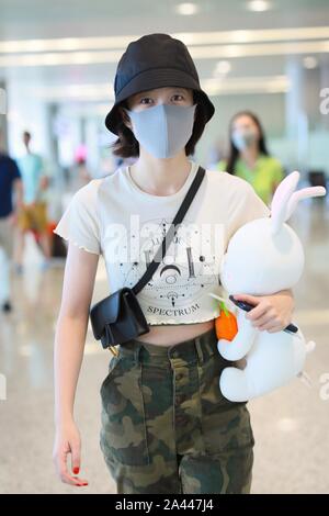 Chinese actress Zhang Xueying, also known as Sophie Zhang, arrives at the Shanghai Hongqiao International Airport before departure in Shanghai, China, Stock Photo