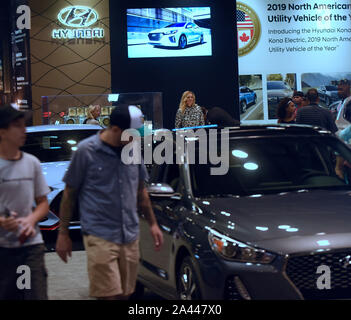 Orlando, United States. 21st Sep, 2019. People look at a display of Hyundai vehicles during the 2019 Central Florida International Auto Show at the Orange County Convention Center.Hyundai and Kia announced on October 11, 2019 that they have agreed to settle a class action lawsuit over engine fires by paying customers who purchased certain Hyundai and Kia models a total of $760 million. Credit: SOPA Images Limited/Alamy Live News Stock Photo
