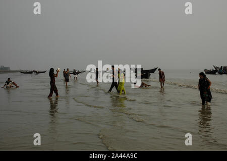 Tourists playing football on the Kuakata sea beach. Patuakhali, Bangladesh. Stock Photo