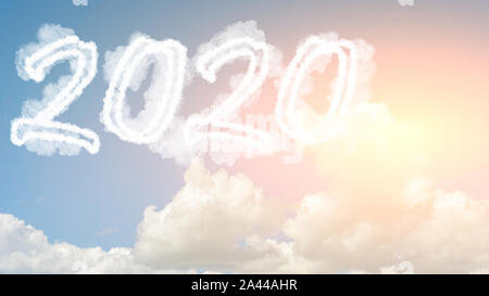 Sunny sky cloud year 2020. Happy New year concept. Numbers 2020 symbol inscription on background of blue sky from white smoke of clouds with bright su Stock Photo