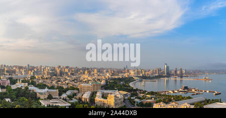Overview panorama of central city business district at the bay with marina and residential suburbs in sunset rays, Baku, Azerbaijan Stock Photo