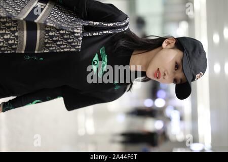 Chinese actress Wu Jiyan appears at an airport in Shanghai, China, 29 August 2019.   Undershirt: Marine Serre  Shorts: Rta  Boots: Timberland  Bag: Di Stock Photo