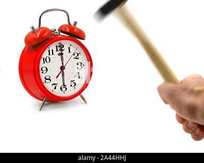 motion blurred hammer hits red alarm clock isolated on white background, stop ringing concept with copy space Stock Photo
