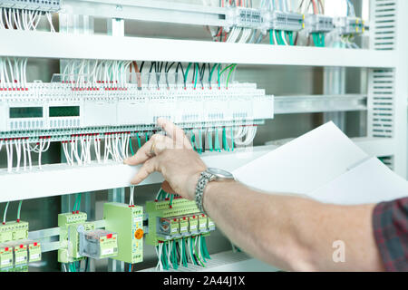 workmen and engineer working an planing on the job showing hands Stock Photo