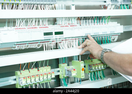 workmen and engineer working an planing on the job showing hands Stock Photo