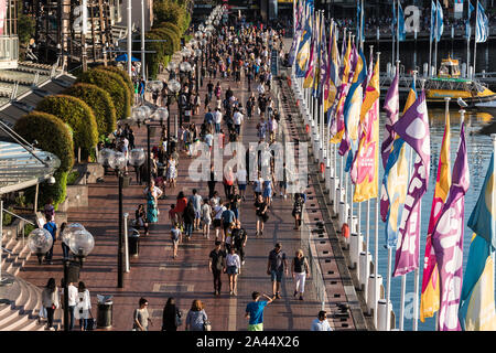 Sydney, Australia - Mar 26, 2016: Aerial view of crowd of people in Darling Harbour. Tourists and locals walking along the promenade on Cockle Bay Stock Photo