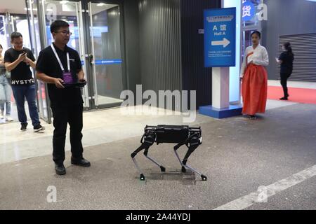 A four-legged robot dog called 'Laikago' developed by Unitree is displayed during the 2019 Word Robot Conference (WRC) in Beijing, China, 20 August 20 Stock Photo