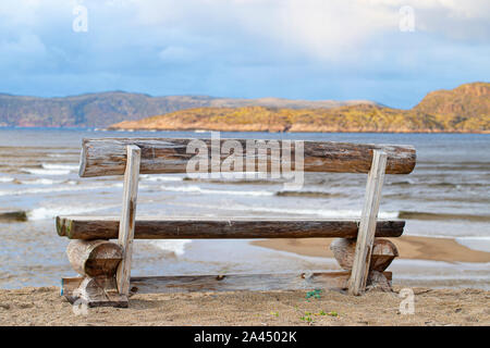 Bench on the beach at the sea. Stock Photo