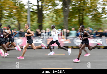 Vienna, Austria. 12th Oct, 2019. Kenya's Eliud Kipchoge(C) competes during the match of '1:59 challenge' in Vienna, Austria, on Oct. 12, 2019. Eliud Kipchoge completed the '1:59 challenge' successfully in 1h 59m 40.2s. Credit: Guo Chen/Xinhua/Alamy Live News Stock Photo