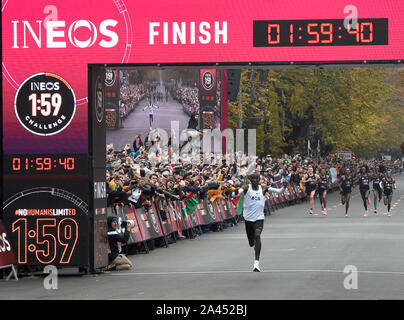 Vienna, Austria. 12th Oct, 2019. Kenya's Eliud Kipchoge crosses the line during the match of '1:59 challenge' in Vienna, Austria, on Oct. 12, 2019. Eliud Kipchoge completed the '1:59 challenge' successfully in 1h 59m 40.2s. Credit: Guo Chen/Xinhua/Alamy Live News Stock Photo