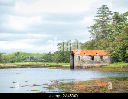 An old boathouse near the town of Westport in County Mayo in Ireland. Westport is County Mayo's premier tourist destination. Stock Photo