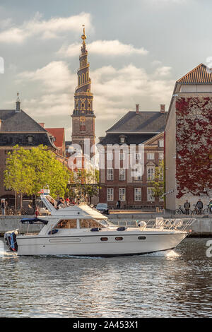 COPENHAGEN, DENMARK - SEPTEMBER 21, 2019: A family motor boat sails on the river past one of copenhagens main tourist attractions Stock Photo