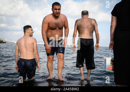 Hairy men on the shore of the Sea of Marmara, Istanbul, Turkey Stock Photo