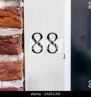House nummber 88 on a white doorpost Stock Photo