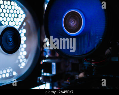 cooler in the system unit of the computer.Light fan for the computer. Metal mesh computer case. Neon light of the system unit, lights, night view Stock Photo