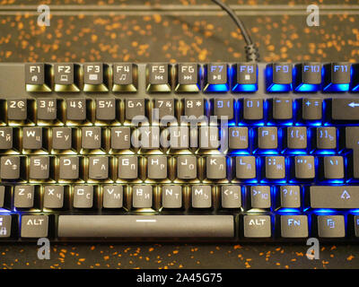 multi-colored keyboard. mechanical keys. Multi-colored professional gaming mechanical rgb keyboard on the table background  Stock Photo