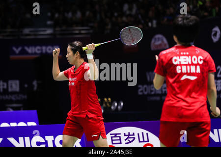 Chinese professional badminton players Jia Yifan and Chen Qingchen compete against Japanese professional badminton players Misaki Matsutomo and Ayaka Stock Photo