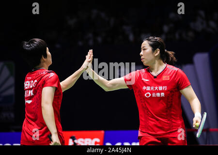 Chinese professional badminton players Jia Yifan and Chen Qingchen compete against Japanese professional badminton players Misaki Matsutomo and Ayaka Stock Photo