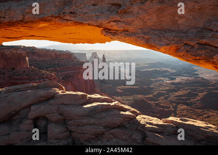 View through Mesa Arch in the Island in the Sky unit of Canyonlands National Park, Utah, USA Stock Photo