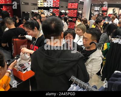 Consumers select and buy products at a Nike store at the newly opened Capital Outlets in Xi an city Northwest China s Shaanxi province 14 September Stock Photo Alamy