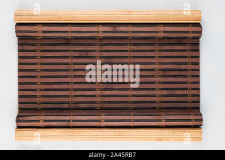 Two bamboo mat twisted in the form of a manuscript. With space for your text. Top view Stock Photo