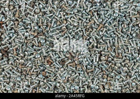 Background of screw bolts, Internal screw, bolts closeup, many screws. Industrial concept. Top view Stock Photo