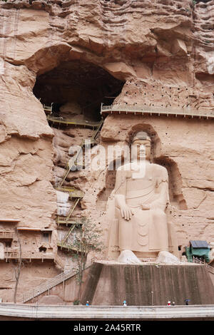 Ancient Chinese Buddha Statue at Bingling Cave Temple in Lanzhou Gansu China. UNESCO World heritage site Stock Photo