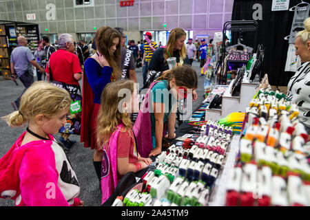 Los Angeles, USA. 11th Oct, 2019. Visitors shop at the Los Angeles Comic Con held in Los Angeles, the United States, Oct. 11, 2019. Los Angeles Comic Con returned to Los Angeles for its 9th year on Friday. Credit: Qian Weizhong/Xinhua/Alamy Live News Stock Photo