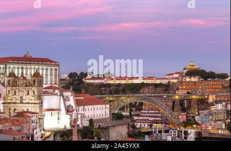 Sunset view of Porto as seen from Miradouro da Vitoria. Looking towards Se do Porto, Luis I Bridge and Serra do Pilar Stock Photo