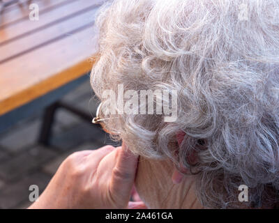 Gray hair of an old woman Stock Photo