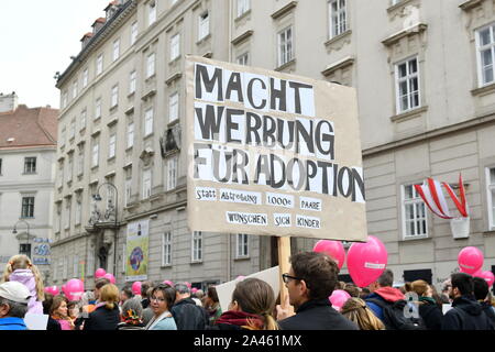 Vienna, Austria. 12th Oct, 2019. Conservative abortion protesters demonstrate again on Saturday, October 12, 2019 in Vienna for the tightening of the 'deadlines regulation'. The 'march for life' is supported by the Archdiocese of Vienna. Banner that reads 'Advertise Adoption'.  Franz Perc / Alamy Live News Stock Photo