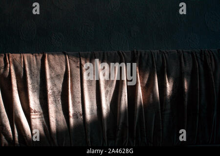 sunlight and shadow falls on a sofa Stock Photo