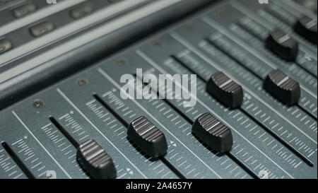 Detail of the faders of a sound mixer from a professional recording studio Stock Photo