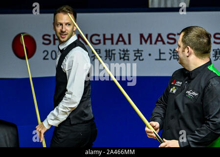 Judd Trump of England, left, and Mark Allen of Northern Ireland, right, look at each other during the quarterfinal of 2019 Snooker Shanghai Masters in Stock Photo