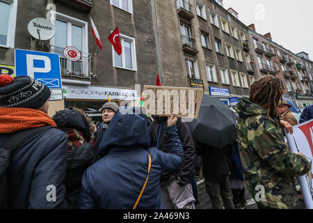 Gdansk, Poland. 12th, October 2019 Protesters with Kurdish flag (Flag of the PYD for Rojava) holding banner which says ' Stop Turkish Aggression '  in front of Turkish Consulate are seen in Gdansk, Poland on 12 October 2019  People protest against Turkey's military invasion in Syria.  © Vadim Pacajev / Alamy Live News Stock Photo