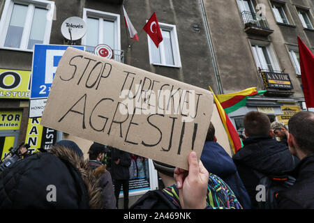 Gdansk, Poland. 12th, October 2019 Protesters with Kurdish flag (Flag of the PYD for Rojava) holding banner which says ' Stop Turkish Aggression '  in front of Turkish Consulate are seen in Gdansk, Poland on 12 October 2019  People protest against Turkey's military invasion in Syria.  © Vadim Pacajev / Alamy Live News Stock Photo