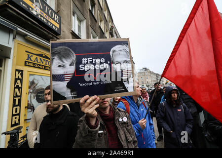 Gdansk, Poland. 12th, October 2019 Protesters with with picture of Julian Assange (The Publisher - Free Assange slogan) and Chelsea Manning (Free Manning the whistleblower slogan) in front of Turkish Consulate are seen in Gdansk, Poland on 12 October 2019  People protest against Turkey's military invasion in Syria.  © Vadim Pacajev / Alamy Live News Stock Photo