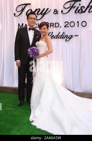 **TAIWAN OUT**--FILE--Malaysian singer Fish Leong and her husband Tony Chao attend their wedding in Taipei, Taiwan, 3 March 2010. Stock Photo