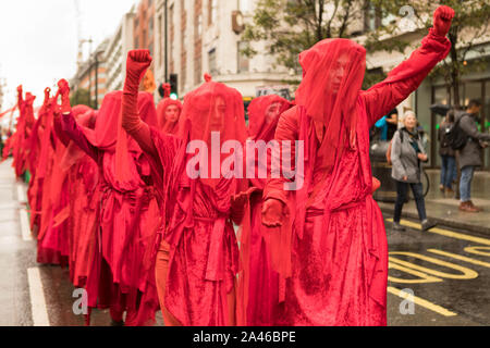 Marble Arch, London, UK. 12th Oct, 2019. Environmental funeral procession, Strength in Grief, organised by Extinction Rebellion. The march is to express profound grief for extinction. Protesters march from Marble Arch, along Oxford Street to Russell Square. Penelope Barritt/Alamy Live News Stock Photo