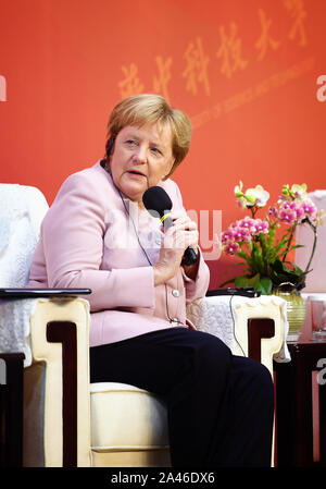 German chancellor Angela Merkel speaks at the Wuhan University of Science and Technology in Wuhan city, central China's Hubei province, 7 September 20 Stock Photo