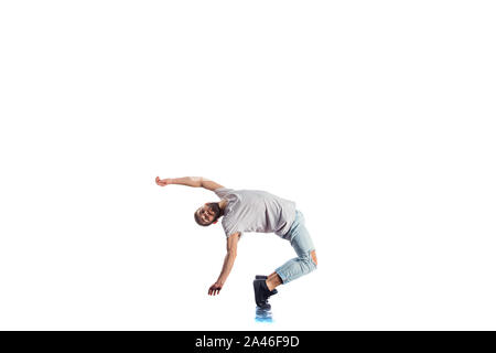 Amazing dancer is doing breakdance on a white background Stock Photo