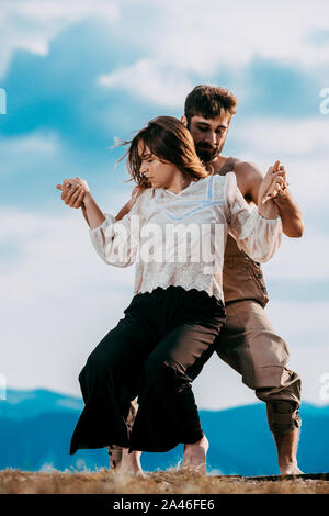 The two young modern ballet dancers training dance routine at the mountain hill Stock Photo